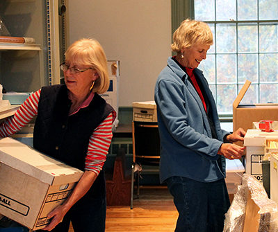 Volunteers Carol Adams and Brooke Tenney work in the Abbott School.