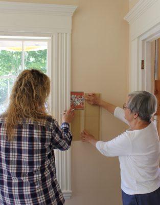 Wallpaper Contractor Cherie Cushman works with Castine Historical Society historic interiors consultant Gail Winkler in the Society’s Grindle House.