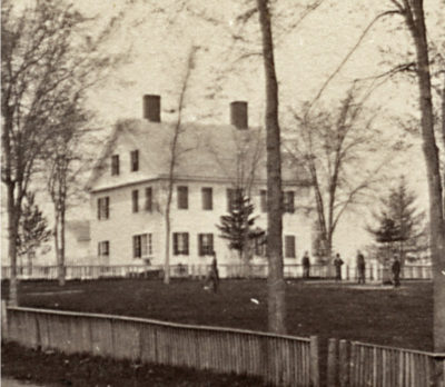 Whitney House built c. 1810 for Henry A. and Lucy Perkins Whitney; occupied by the British in 1814. Note the Town Common fence in foreground.