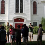 Curator Paige Lilly leads a walking tour around Castine.